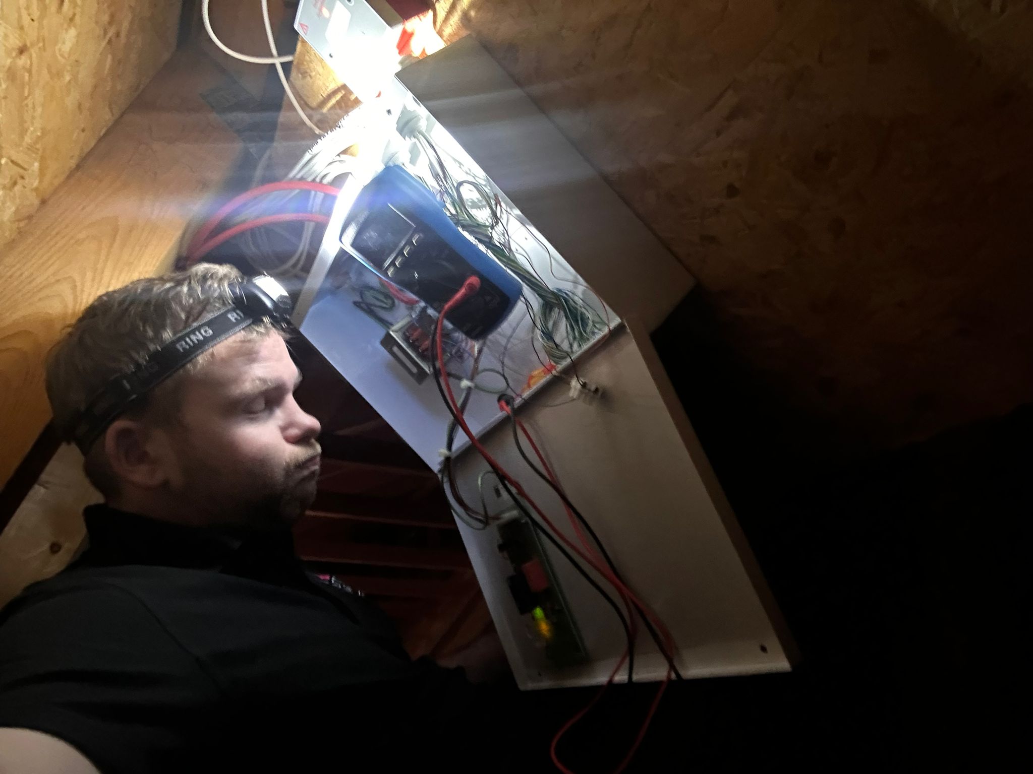 up in a loft pulling cables