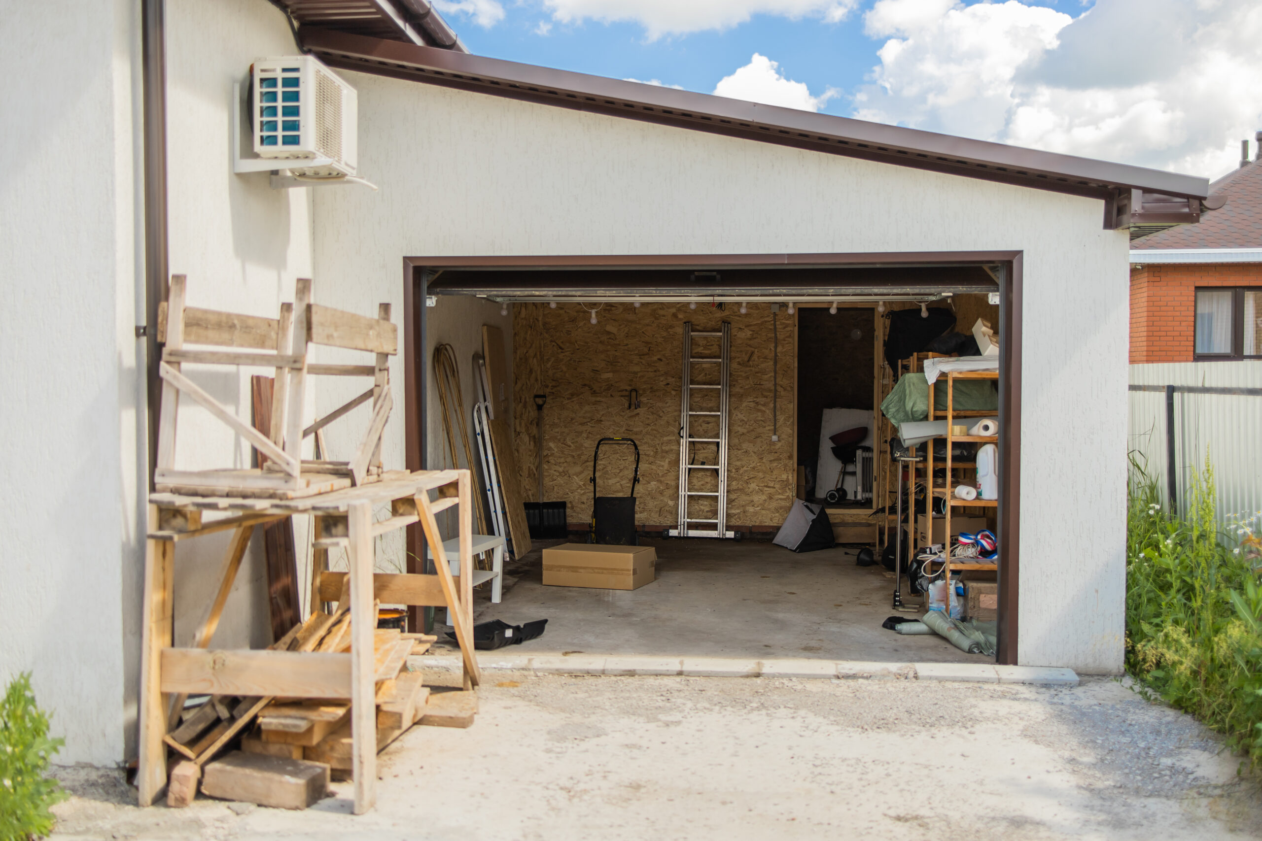open garage with tools wooden planks organized storage efficient use residential scaled